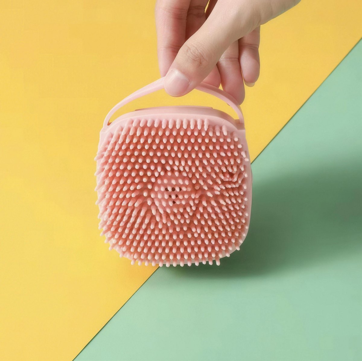 Flexible bristles and hand loop on pet bath brush